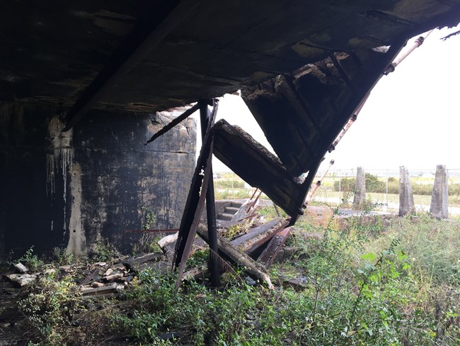 Concrete falls from a elevated position.