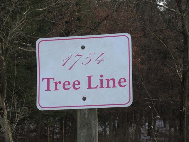 A sign showing the location of the 1754 tree line