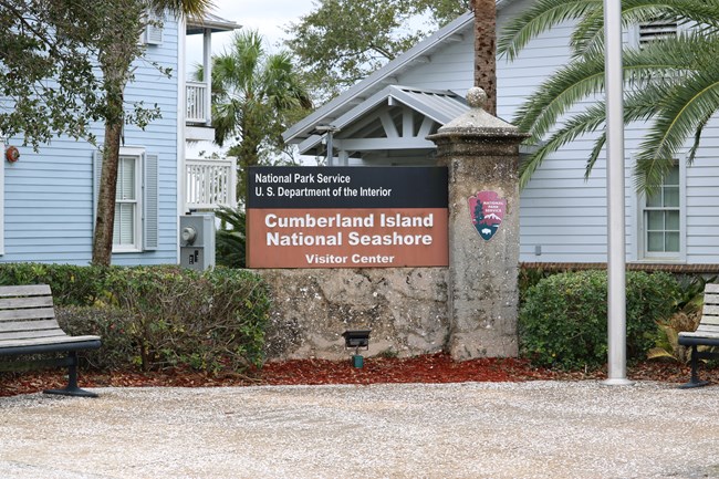 Sign in front of a building that reads Cumberland Island National Seashore