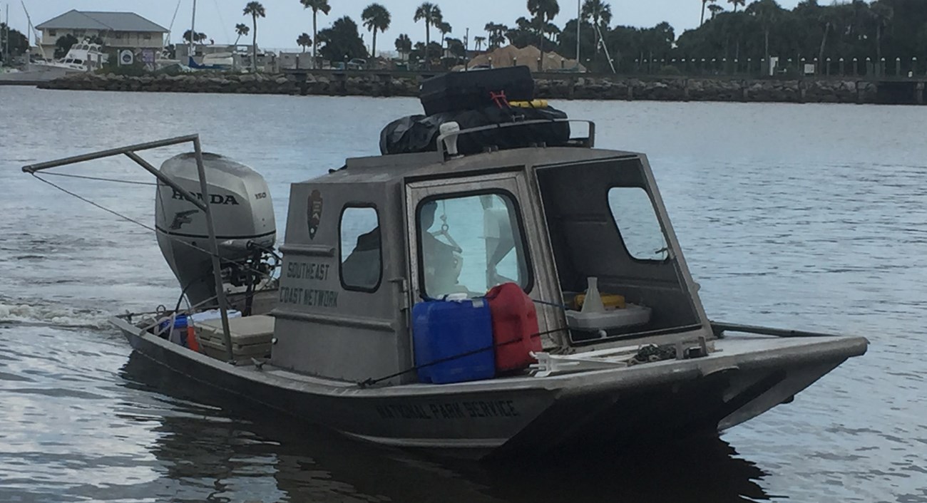 A boat travels across the water.