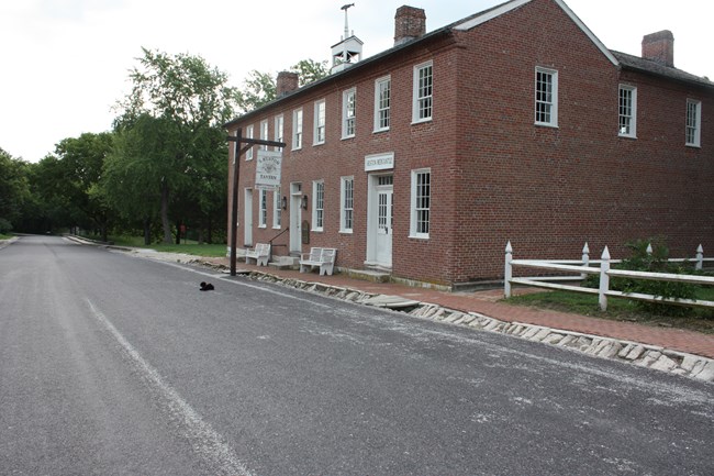 toy dog near a brick building