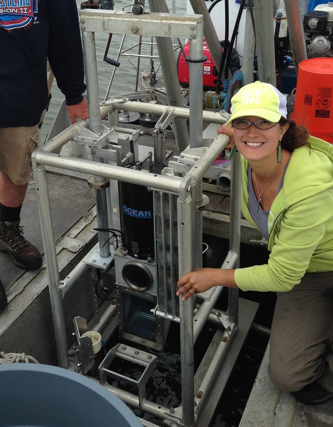 Monique LaFrance and sonar equipment on the research boat.