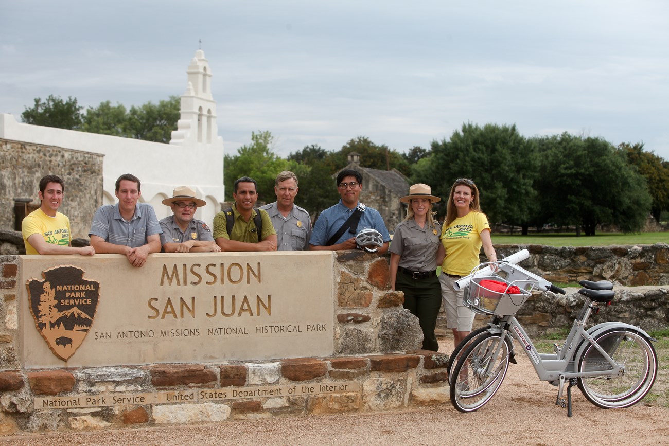 Representatives of the National Park Service, the city of San Antonio, and San Antonio Bike Share gather at Mission San Juan to celebrate the extension of the San Antonio Bike Share system. Representatives of the National Park Service, the city of San Antonio, and San Antonio Bike Share gather at Mission San Juan to celebrate the extension of the San Antonio Bike Share system.