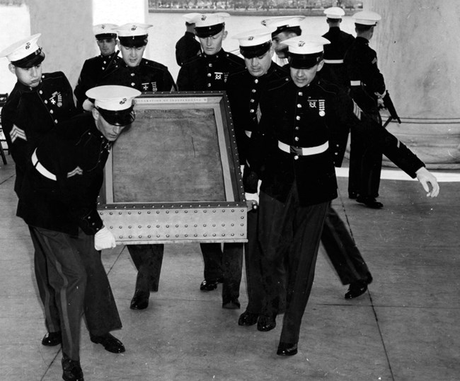 Six U.S. Marines carry the Declaration of Independence into the Jefferson Memorial