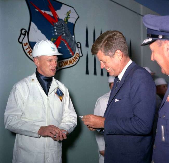 President Kennedy at Vandenberg Air Force Base The president receives a gift from an air force officer