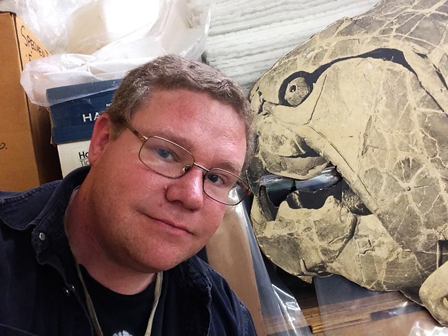 scientist with large fossil image