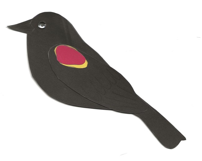 JRJr red-winged blackbird craft completed NPS web Black bird with red and yellow patches on its wing.