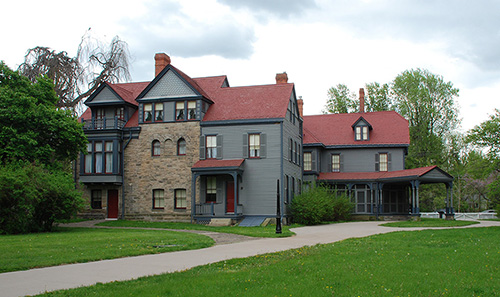 James A. Garfield Home Outdoor view of Garfield's blue house with a red roof.