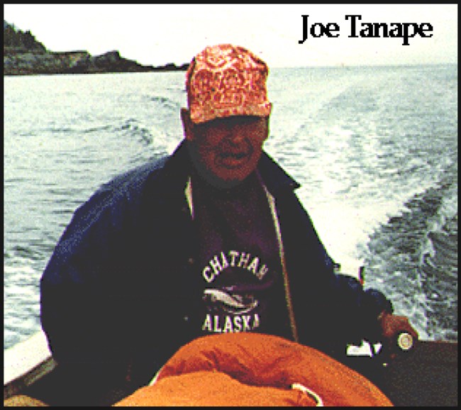 A man driving a boat from outboard motor