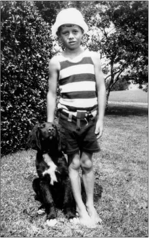 lt= A boy and a dog outside