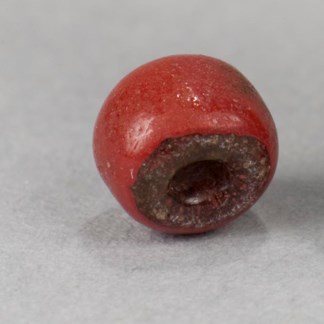 A red glass bead from Kijik National Historic Landmark