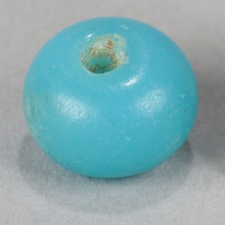 A light blue glass bead from Kijik National Historic Landmark