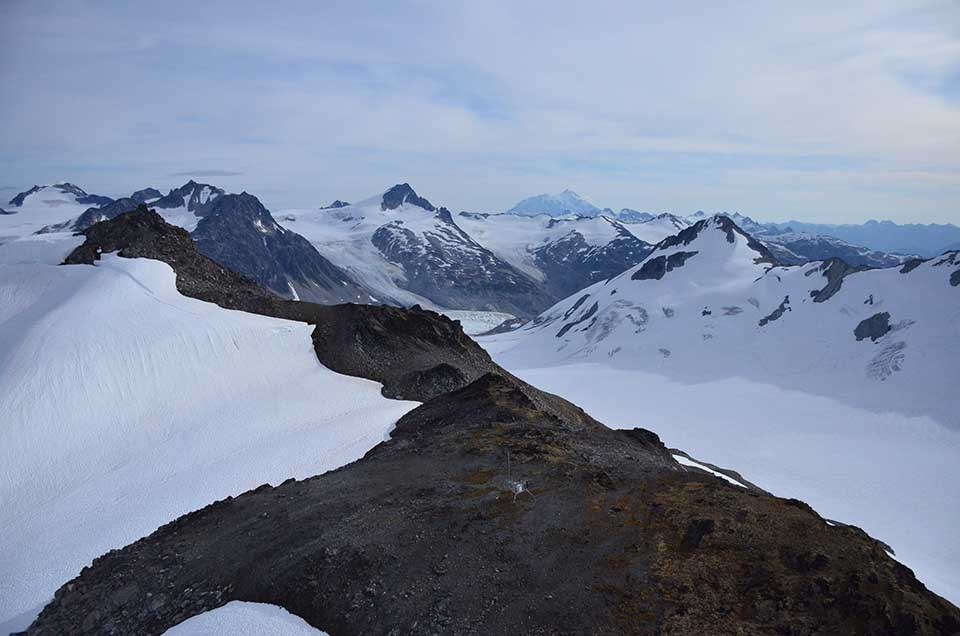 LACL Chigmit Mtns A mountain ridge surrounded by snow.