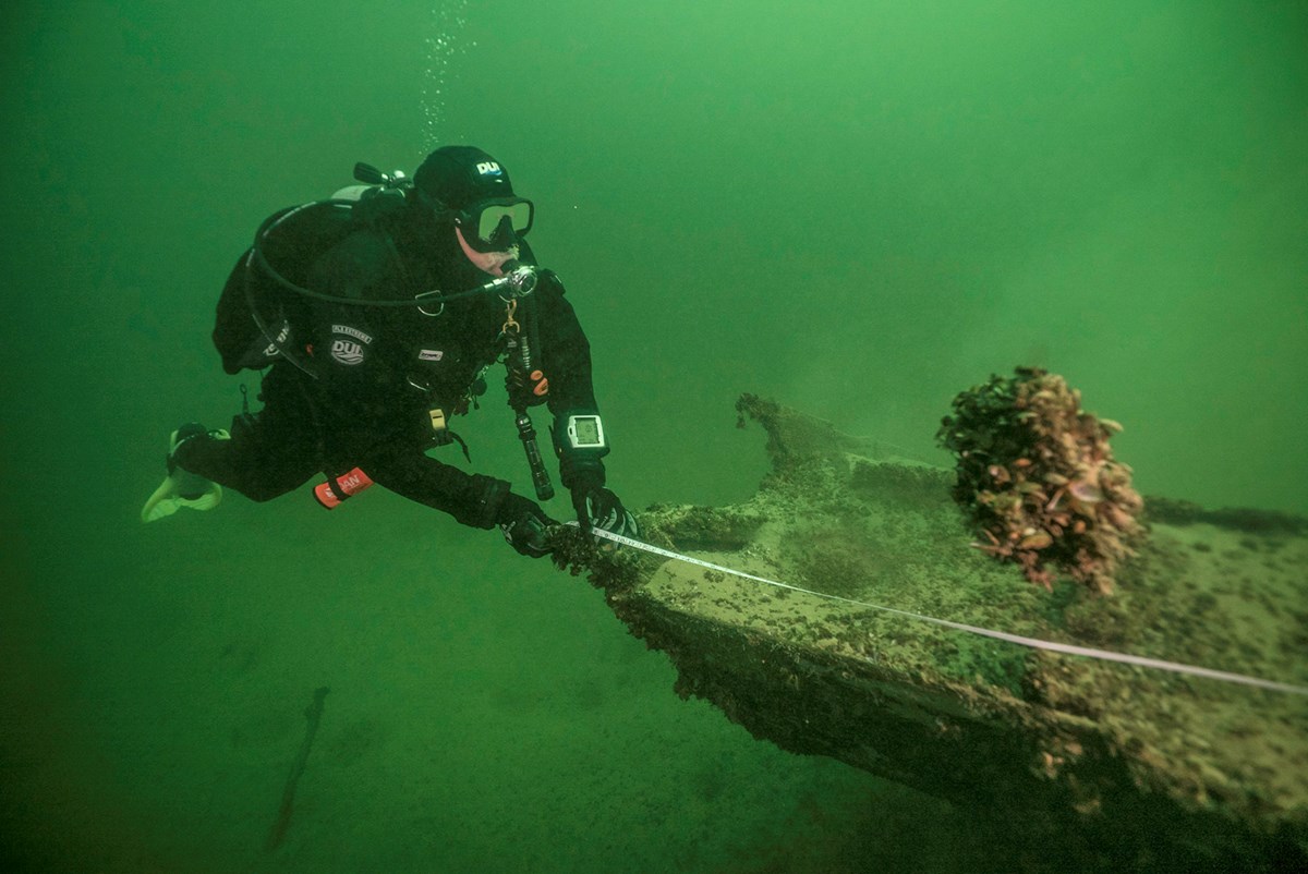 divers assess underwater resource