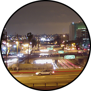 Light at night in Los Angeles Cityscape featuring lights from cars, streetlights, and buildings.