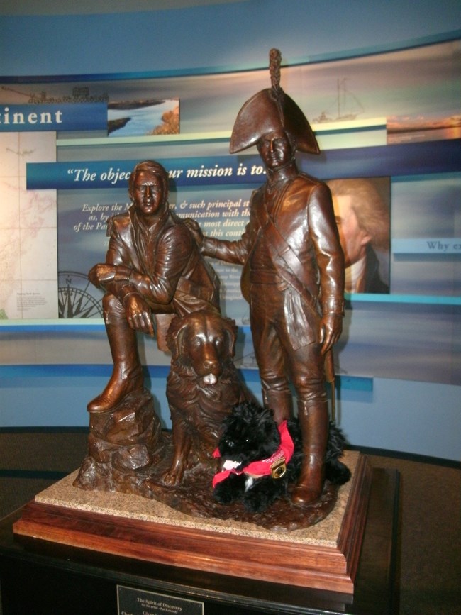 stuffed dog near statue