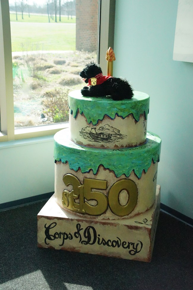 stuffed pup near display birthday cake