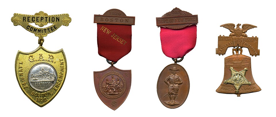 LONG GAR Medals Four medals: gold and silver colored shield-shaped medal, shield-shaped medal on dark red ribbon, oval medal with standing figure on red ribbon, medal in shape of bell surmounted by eagle