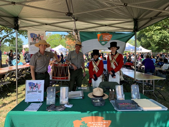 Rangers and volunteers pose at a local festival