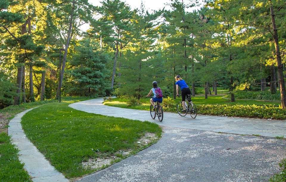 LYBA_Bicyclists Two bicyclists on a paved trail