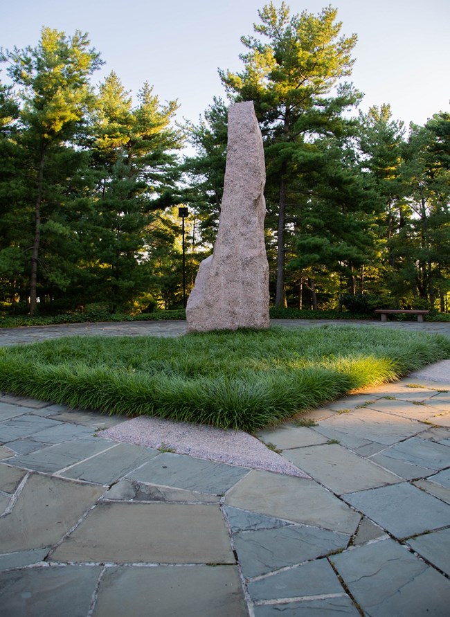 LYBA_MonolithSunset Granite monolith standing in a patch of grass
