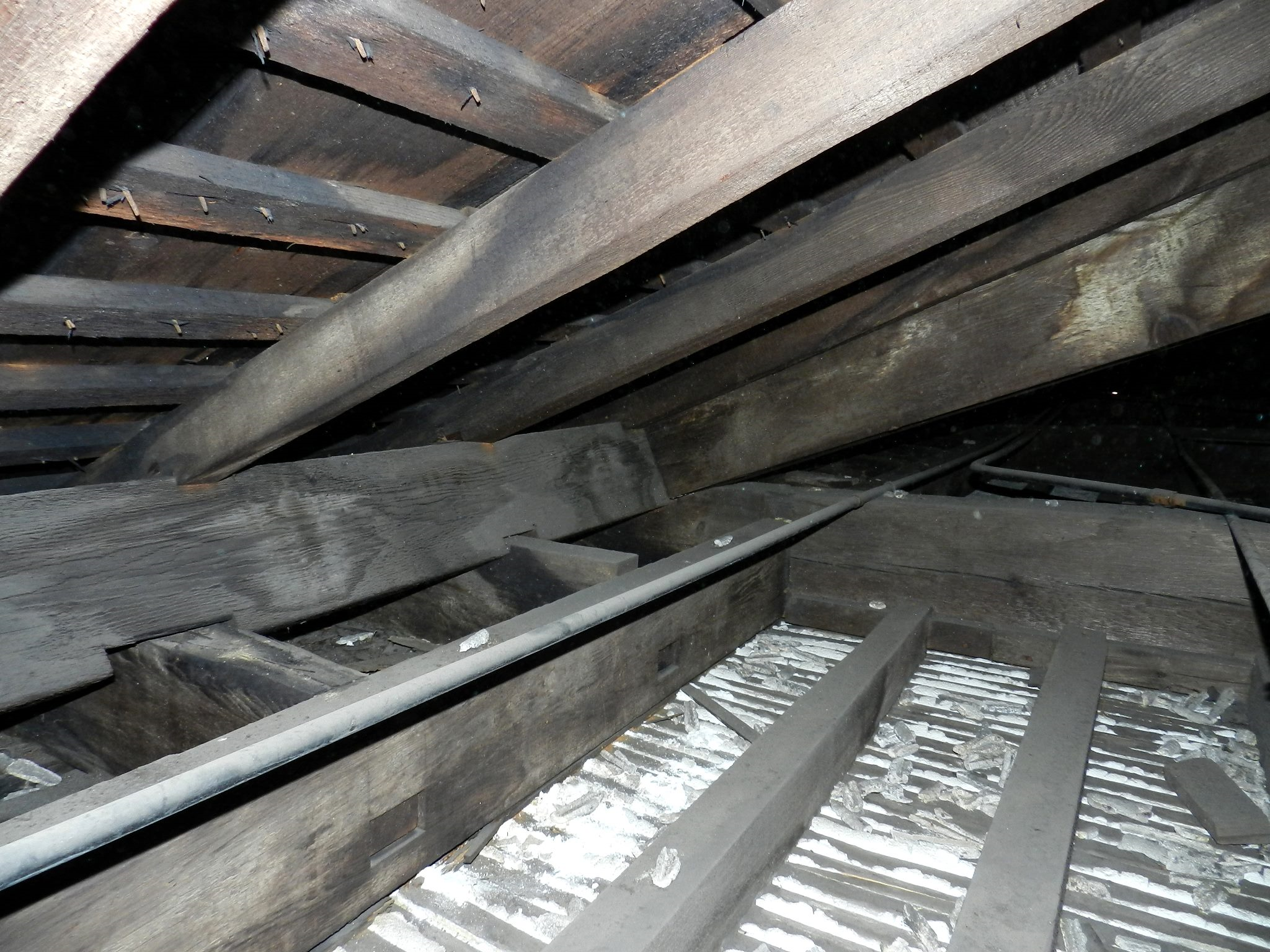 Wooden beams with white plaster in-between.