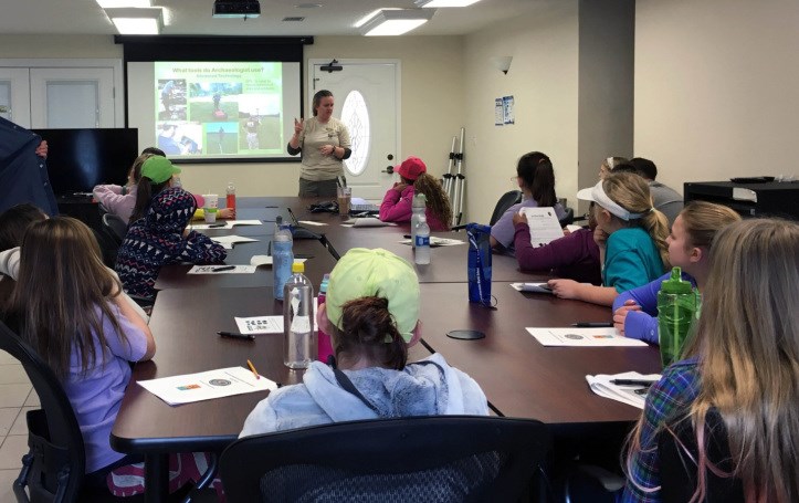 Learning about archeology at Fort Frederica National Monument Archeologist giving presentation about archeology at Fort Frederica National Monument