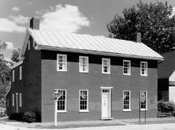 Levi Coffin House B&W photo of a two-story brick home with many windows.