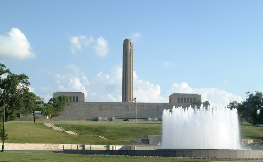 Tall stone structure and a water fountain.