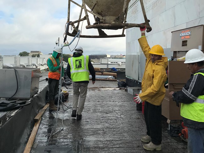 Construction workers on the Lincoln Memorial roof