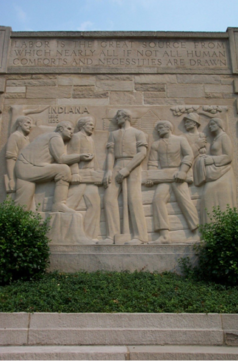 Stone memorial panel depicting scenes from Lincoln's life. (Lincoln Boyhood National Memorial)