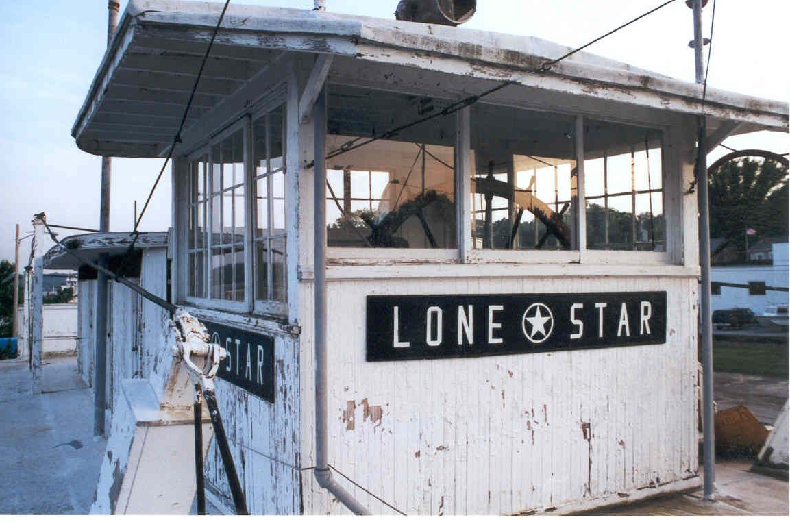 White boat with the words "Lone Star" in black and white.