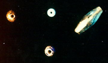 Photo of different shaped Amber button and beads worn for protection