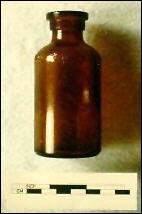 Photo of a brown glass Lysol bottle.