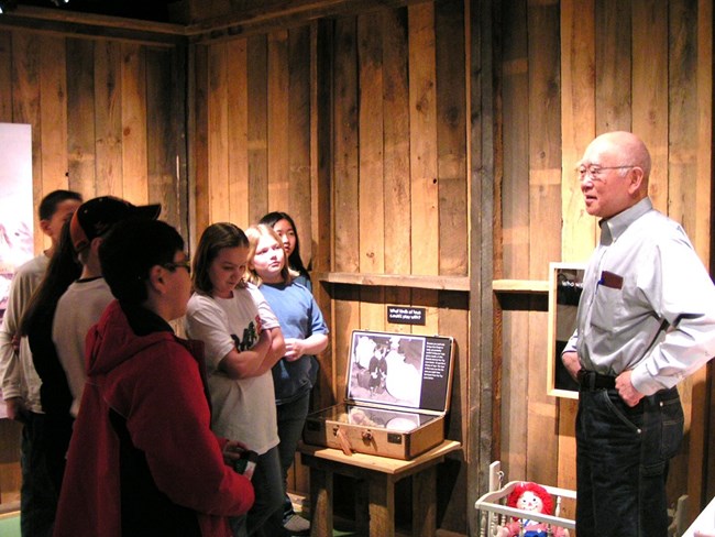 MANZ Sab with kids 960 Docent giving a tour to kids