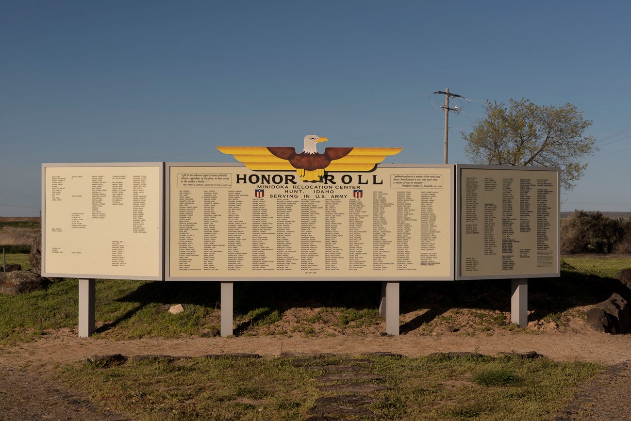 Outdoor exhibit panels titled "Honor Roll" listing names of Minidoka incarcerees who served in the US Army