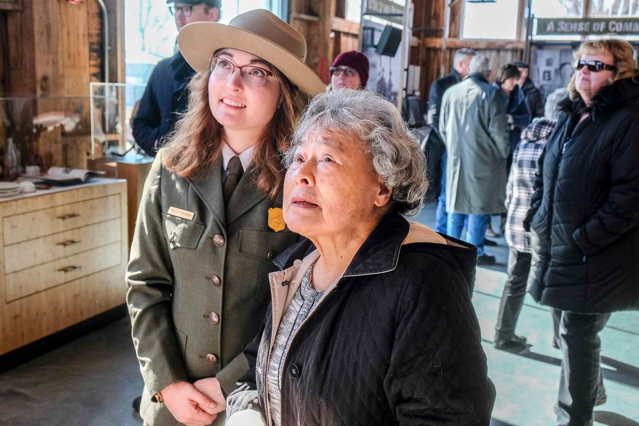 Ranger and her grandmother in a visitor center