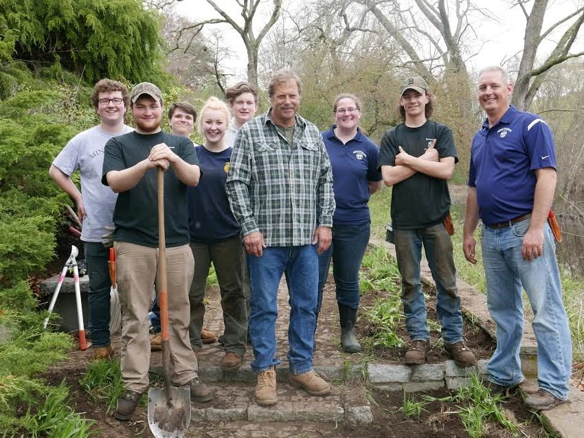 Horticulture Students High School students and teachers with tools pose for outdoor photo.