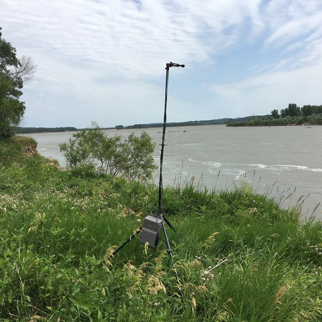 Acoustic monitoring station along the Missouri River Bat acoustic monitoring equipment set up on the bank of the Missouri River