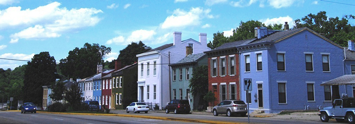 Madison, Indiana Colorful town house fronts with a street in front.