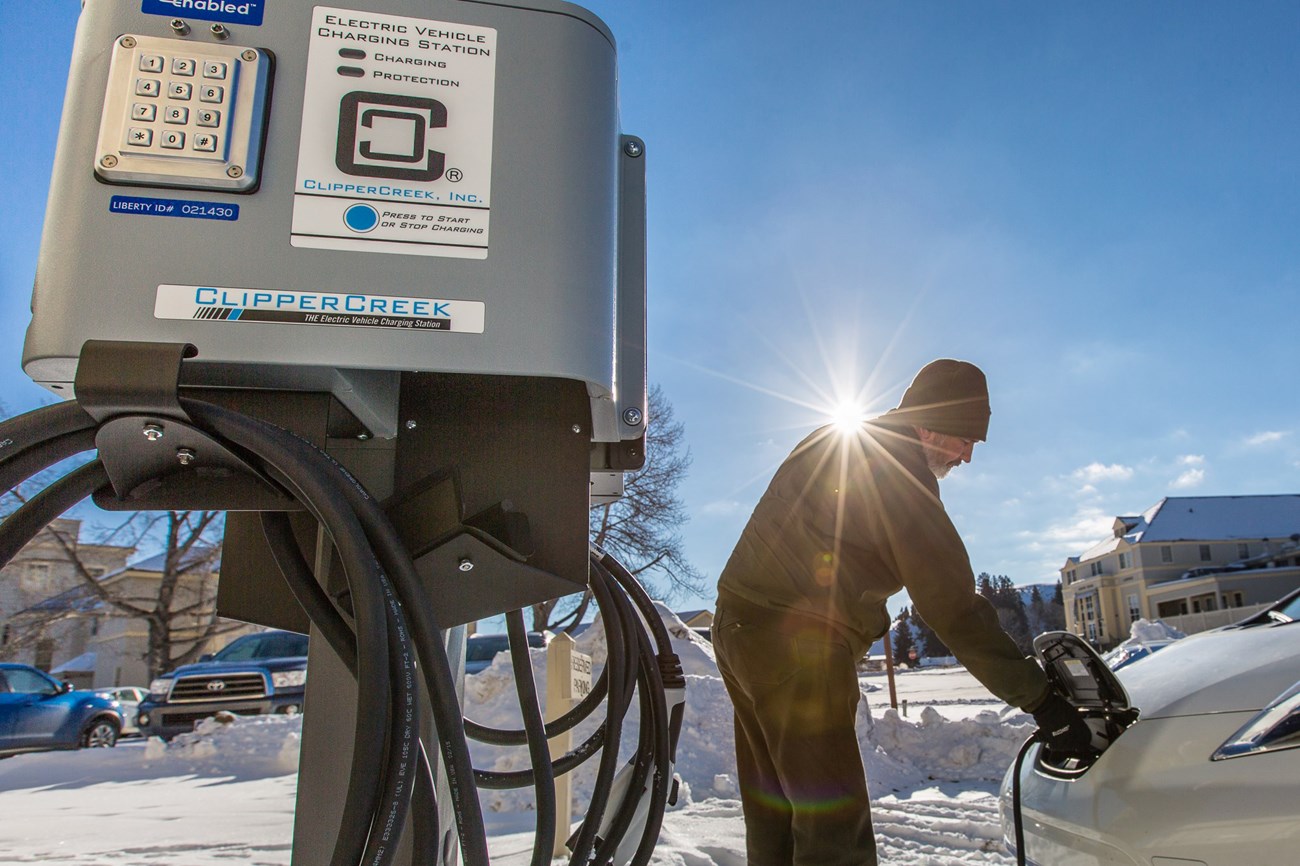 Staff at an electric vehicle charging station at the Mammoth Hot Springs Hotel.