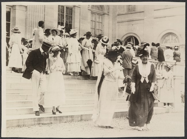 Marble House meeting Photograph of women and men on steps leading up to Marble House, Alva Belmont's estate in Newport, RI.