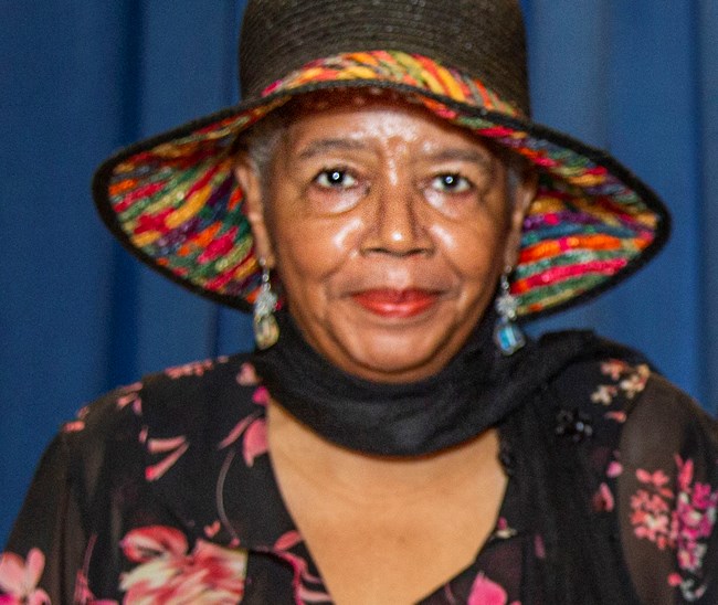 African American woman wearing a hat