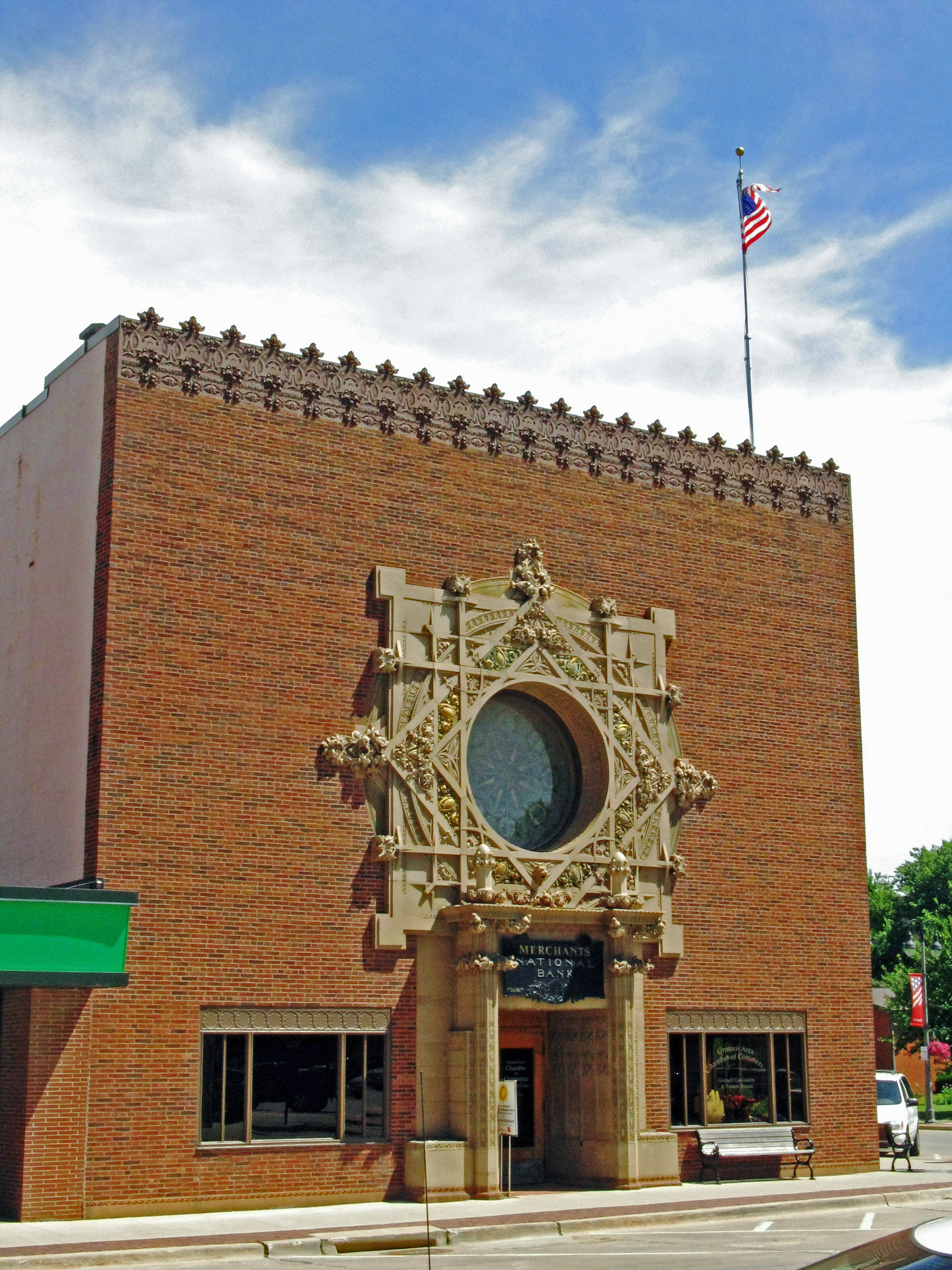 Brick building with a circle window and architectural detail.