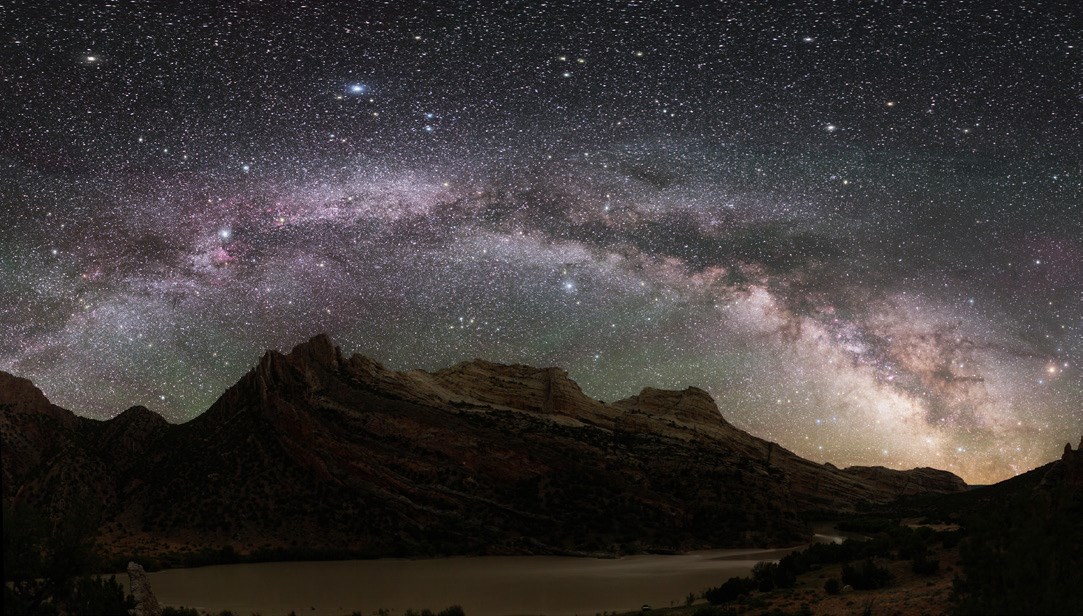 Milky Way over Dinosaur National Monument Full arc of the Milky Way framing rock formations below. Photo by NPS / Dan Duriscoe