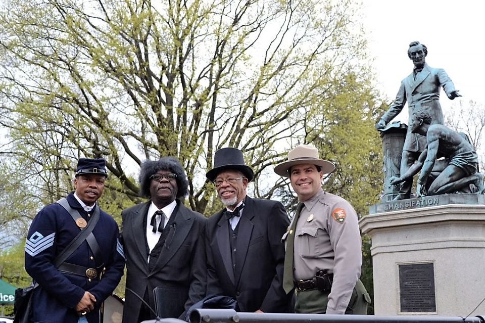 NACE Vince Ranger at the Bicentennial Commemoration of Fredrick Douglas in front of statue