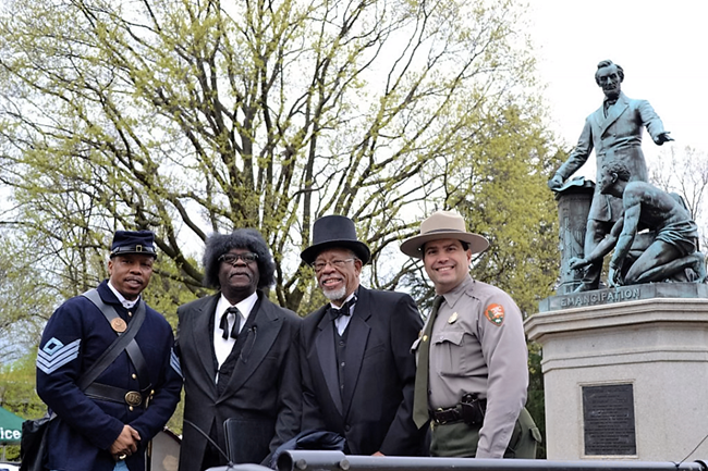 NACE Vince Ranger at the Bicentennial Commemoration of Fredrick Douglas in front of statue