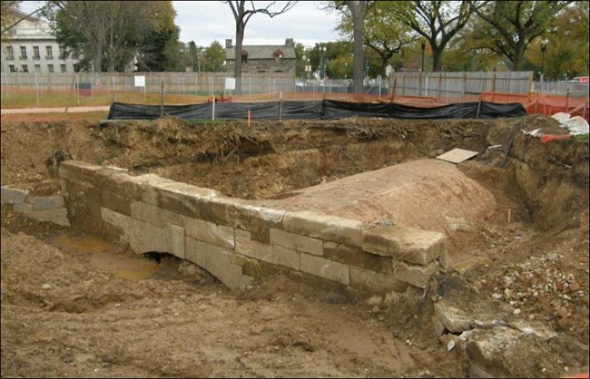 Headwall from sewer canal outlet that emptied into the Potomac River; the “grave error in sewage disposal” described by Hains. Lockhouse B is in the background of photo.