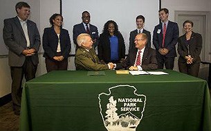 Leaders at a signing ceremony table