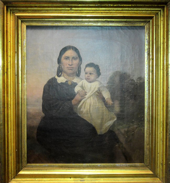 Natawista and child Woman seated holding baby on lap